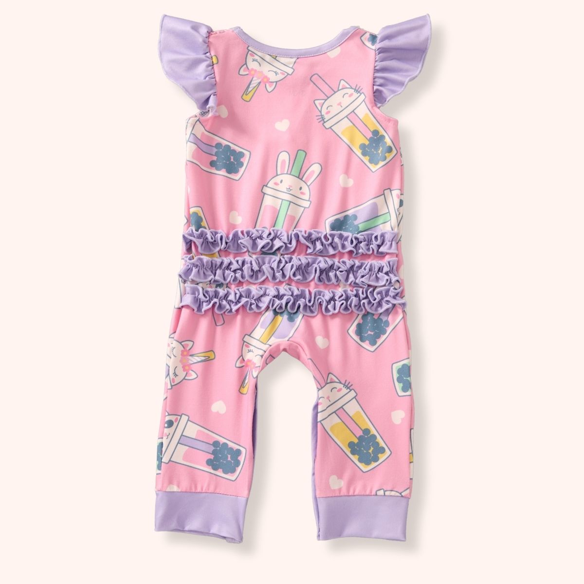 Back view of the Pete + Lucy Bubble Tea Outfit Set, a baby romper made from soft milk silk fabric. The design features a pastel pink background with whimsical cartoon boba drinks decorated with cat and bunny faces. The romper includes lavender flutter sleeves, lavender ankle cuffs, and three rows of lavender ruffles across the bottom.