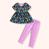 Two-piece girls outfit with a dinosaur galaxy print dress top and solid lavender leggings, designed for comfort and everyday play.