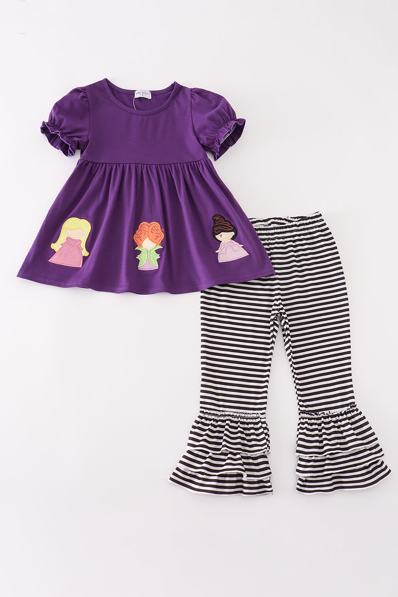 Purple tunic with witch appliqués and striped ruffle pants, laid flat on a white background for a full outfit view.