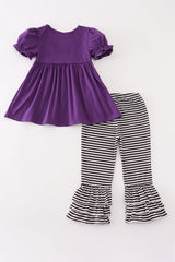 Back of purple tunic and striped pants shown without appliqués or added detail.