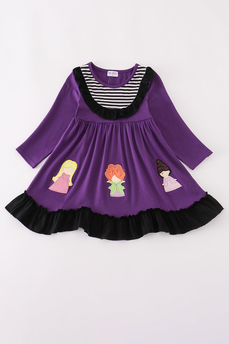 Purple dress with striped neckline, black ruffle trim, and appliqué of three witches across the hem.