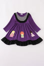 Purple dress with striped neckline, black ruffle trim, and appliqué of three witches across the hem.