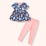 Flat lay of a navy short-sleeve tunic with pastel hot air balloon and floral print paired with soft pink leggings.