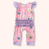 Back view of the Pete + Lucy Bubble Tea Outfit Set, a baby romper made from soft milk silk fabric. The design features a pastel pink background with whimsical cartoon boba drinks decorated with cat and bunny faces. The romper includes lavender flutter sleeves, lavender ankle cuffs, and three rows of lavender ruffles across the bottom.