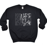 Black sweatshirt with white text on a white background