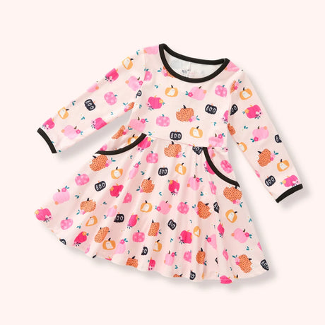 Girls cream long sleeve dress with pink and orange pumpkins, black trim, pockets and scattered “BOO” print.