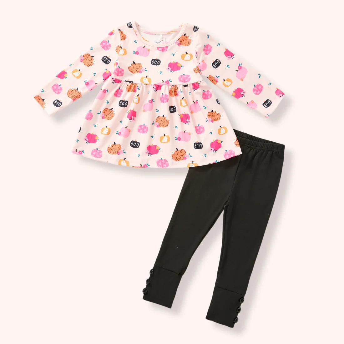 Girls cream pumpkin and “BOO” print tunic with black button-cuff leggings.