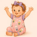 A storybook-style illustration of a baby girl wearing the Pete + Lucy Bubble Tea Romper. The romper is a one-piece design with flutter sleeves and lavender ankle cuffs, printed with playful pastel boba cups featuring bunny, cat, panda, and unicorn faces on a pink background with white hearts. The baby has light brown skin, short curly hair, and both arms raised joyfully in the air, set against a soft pale pink backdrop.