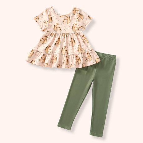 Blush pink pony print tunic with a tiered ruffle hem and solid sage green leggings.