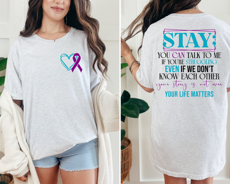White t-shirt with a heart and ribbon design on the front, and motivational text on the back.