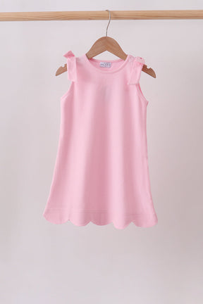 Blush Pink Scalloped Dress for girls with shoulder bows and soft cotton fabric
