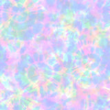 Pastel tie-dye fabric close-up with softly blended pink, lavender, mint, aqua and pale yellow in a dreamy watercolor pattern.