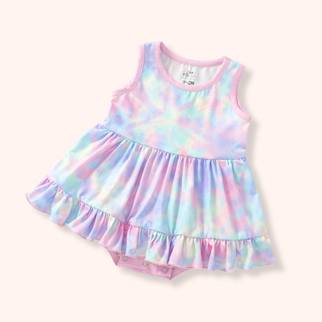 Flat lay of pastel tie-dye baby bubble with pink trim, sleeveless bodice, ruffle skirted hem, and snap closures underneath.