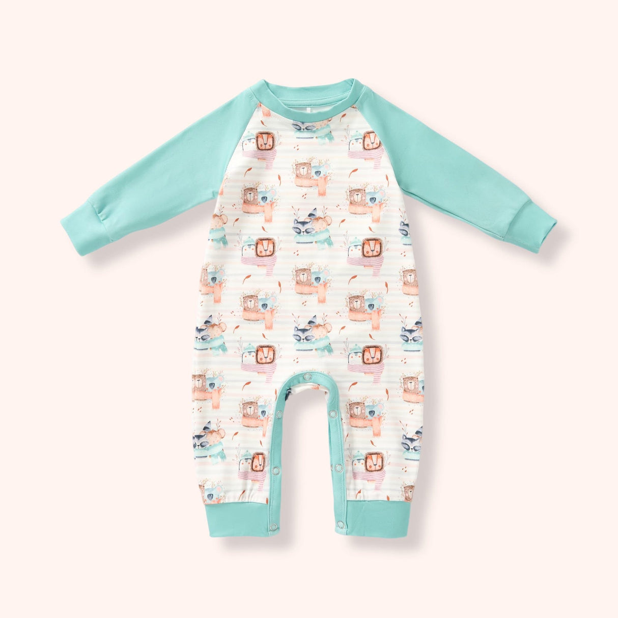 White romper with mint raglan sleeves and cuffs, snap bottom, and a soft woodland animal print on a pale blush background.