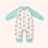 White romper with mint raglan sleeves and cuffs, snap bottom, and a soft woodland animal print on a pale blush background.