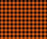 A repeating buffalo plaid pattern in bright orange and black, with some squares showing diagonal hatching texture.