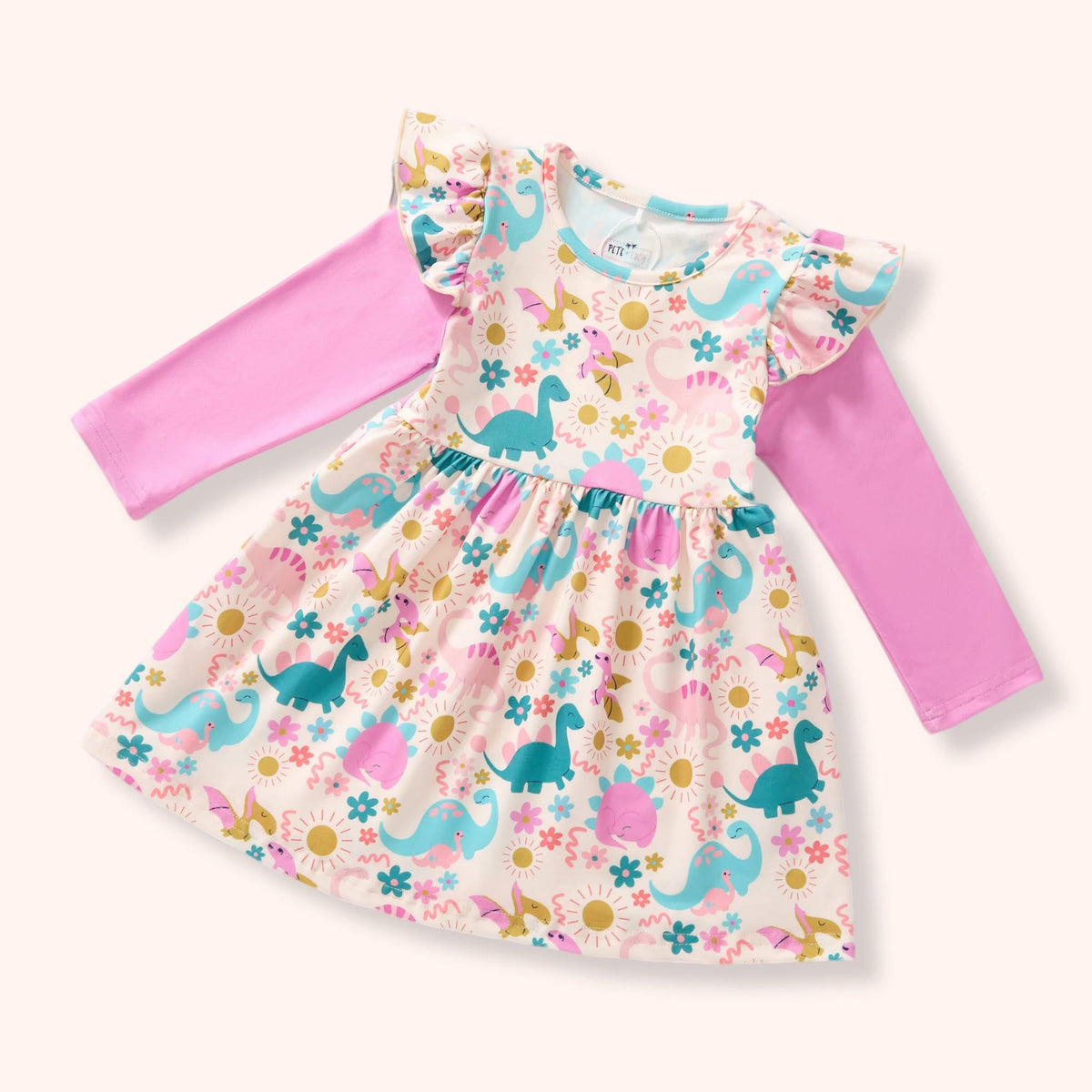 A girl's long-sleeve dress featuring a pink long-sleeve base and a printed skirt with a cream background, colorful flowers, and dinosaurs in teal and pink. 