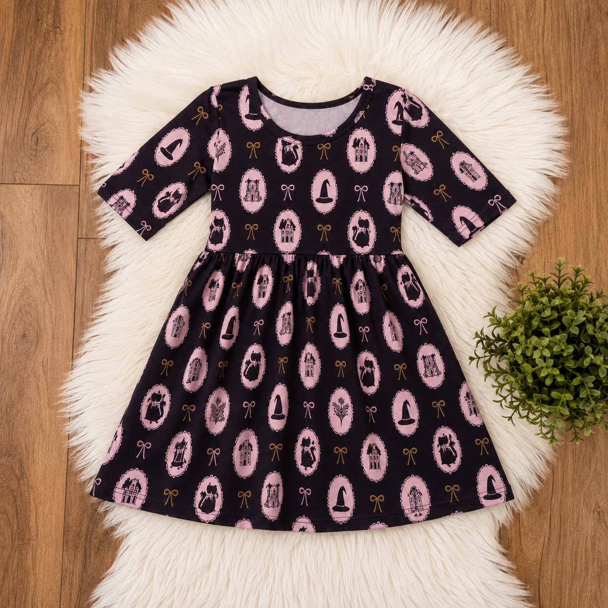 Dark charcoal dress with pink cat cameos, pumpkins, bows and tiny gold Halloween details.