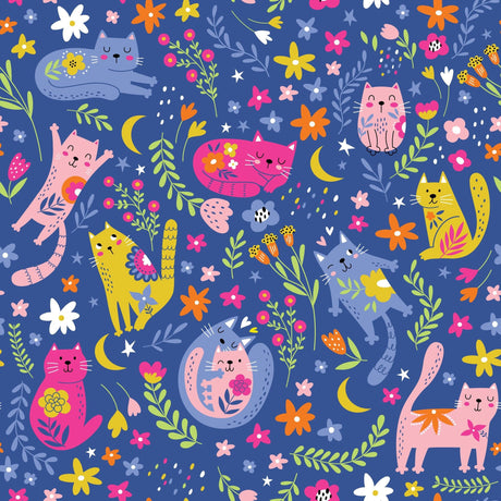 Blue fabric close-up with colorful whimsical cats, flowers, leaves, crescent moons and stars in pink, yellow, orange and green.