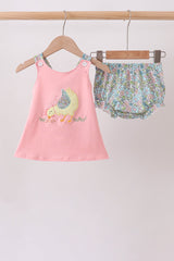 Baby girls’ pink chick bloomer set with a sleeveless appliqué tunic, floral shoulder straps, and matching floral ruffle bloomers.