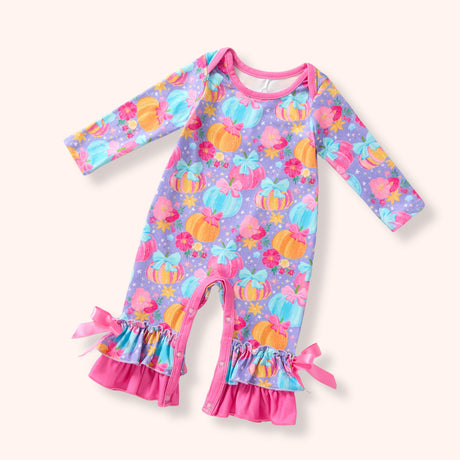 Lavender pastel pumpkin romper with pink bows, ruffle cuffs and snap closures.