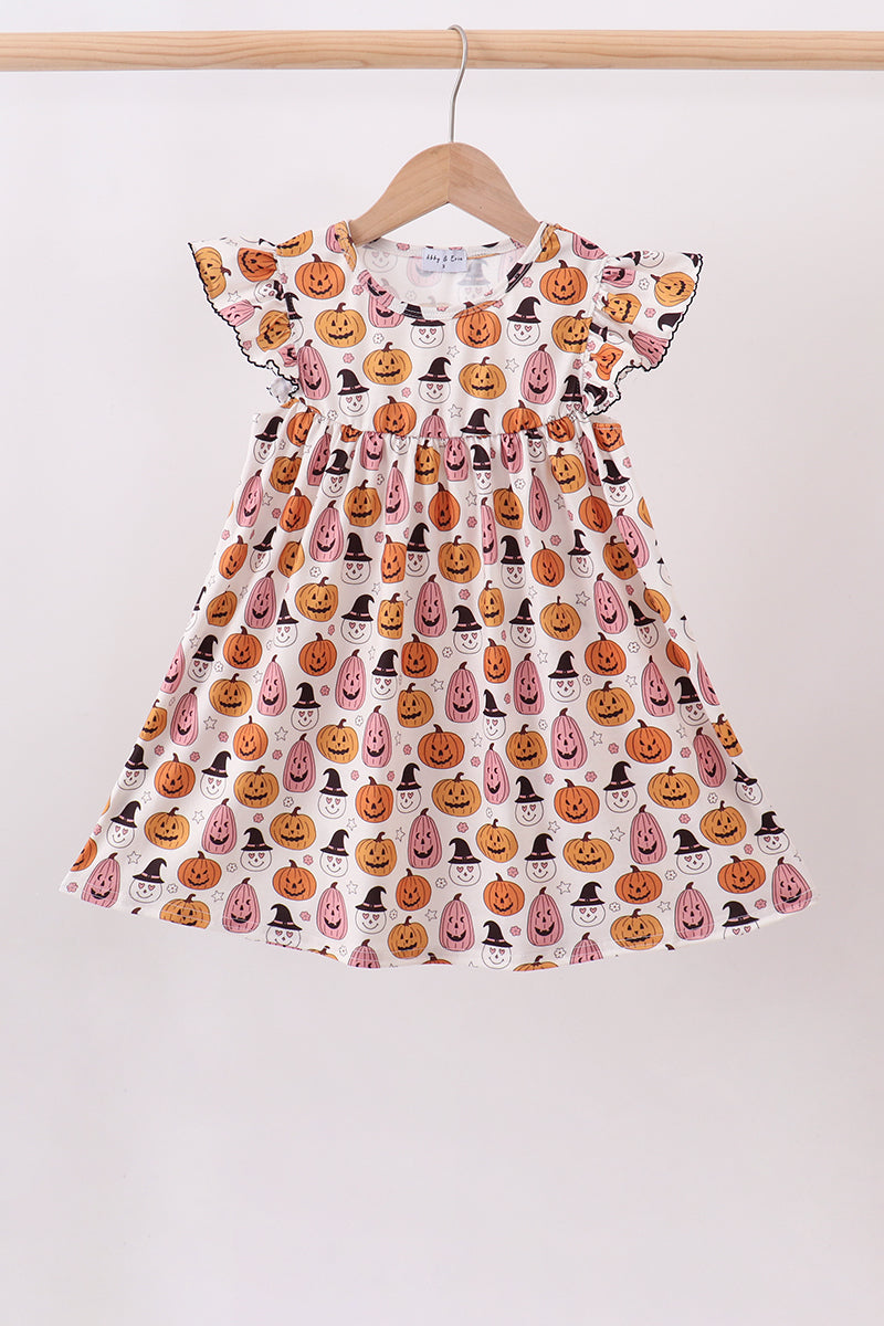 Girls’ cream twirl dress with pink and orange jack-o’-lanterns, little witches and flutter sleeves.