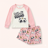 Pink Sleepover Squad pajama set with a cream panda graphic raglan top and matching printed shorts.
