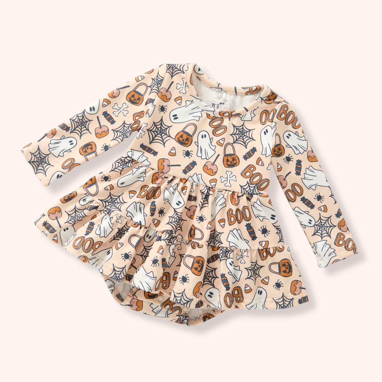 Peach skirted baby bubble with an allover Halloween print of ghosts, pumpkins, candy, webs and “BOO.”