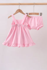 pink football bloomer set with a ruffled sleeveless top, football appliqué pockets, and matching ruffle-trim shorts.