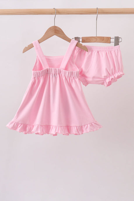 pink football bloomer set with a ruffled sleeveless top, football appliqué pockets, and matching ruffle-trim shorts.