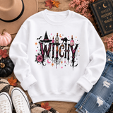 White crewneck sweatshirt with a gothic “WITCHY” graphic featuring potion bottles, a black cat, witch hat, rose, bats, moon and stars.